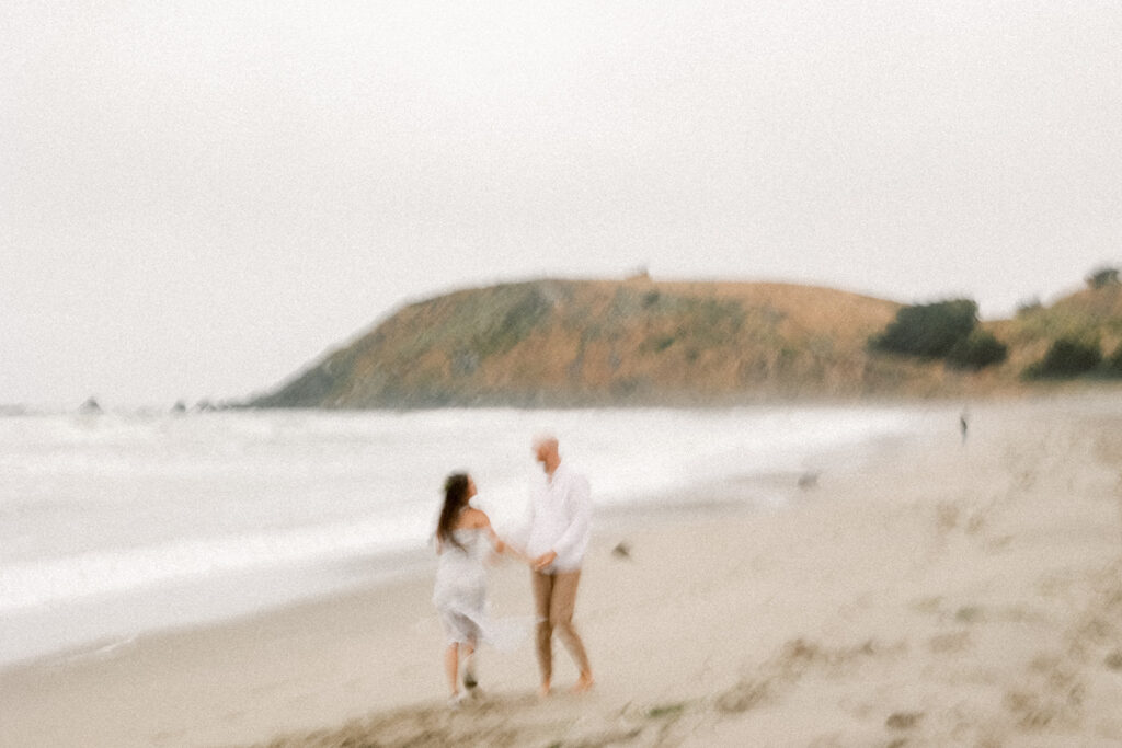 blurred motion of Harley and Ethan on the beach