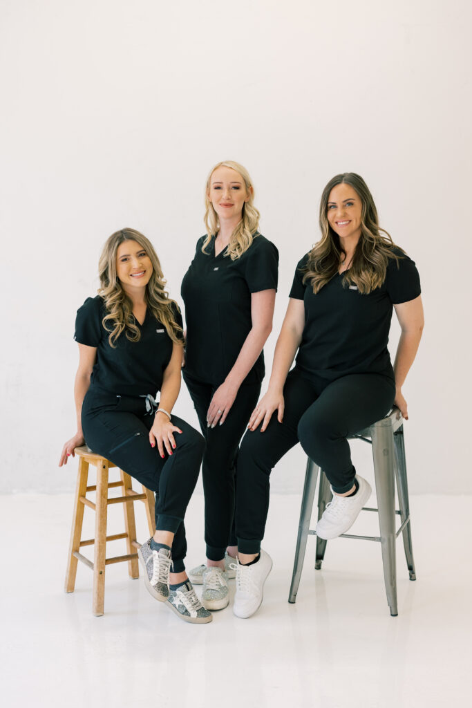 team/group photo in black scrubs in the studio