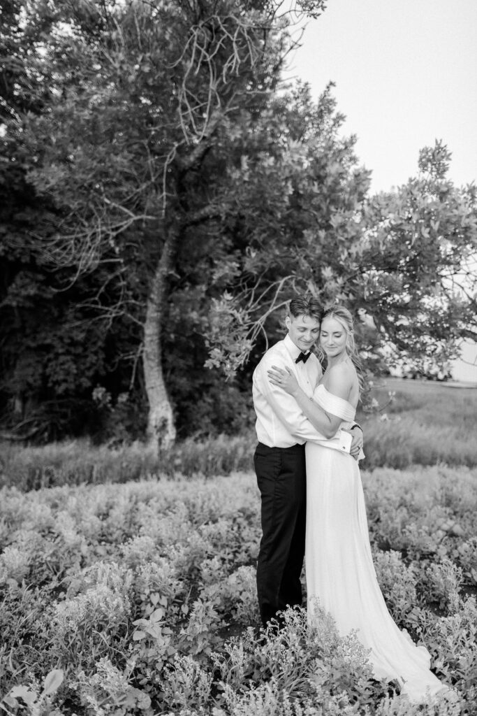 bride and groom at sunset in black and white 