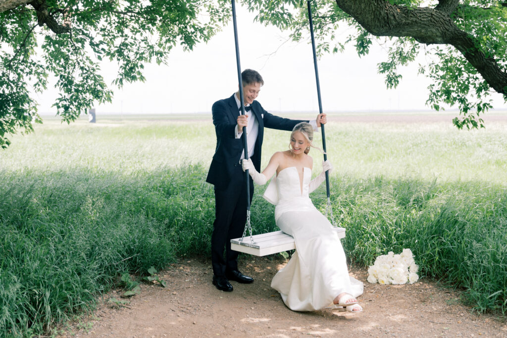 bride and groom on swing 
