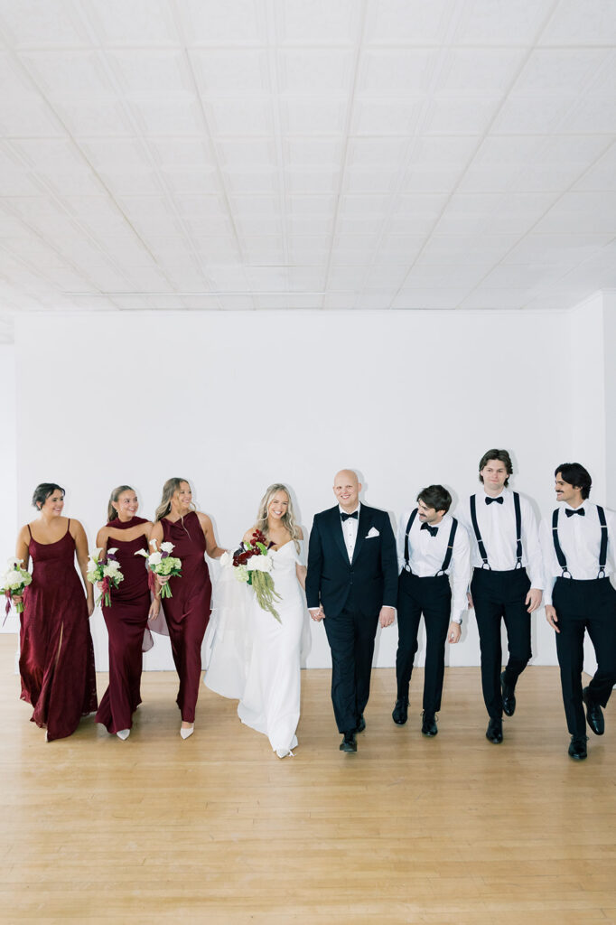 wedding party photos walking towards the camera