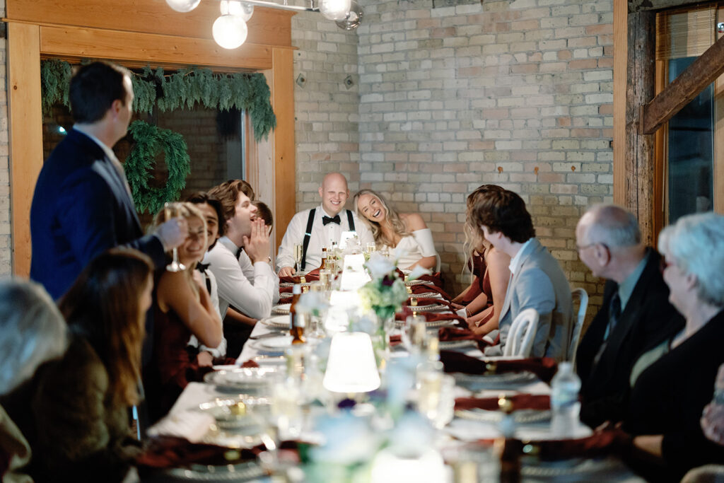 bride and groom eating at reception