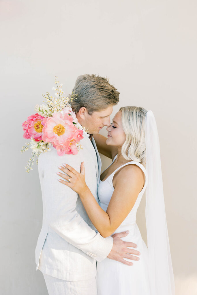 Couple hugging at a Scripps Seaside elopement