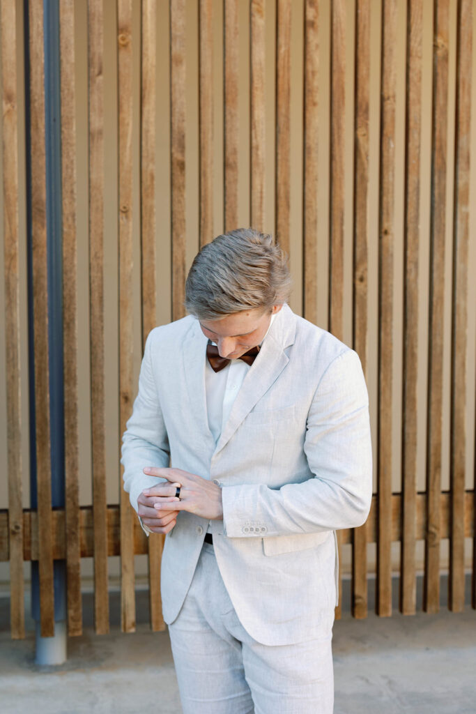 Groom at Scripps Seaside beach during an intimate elopement
