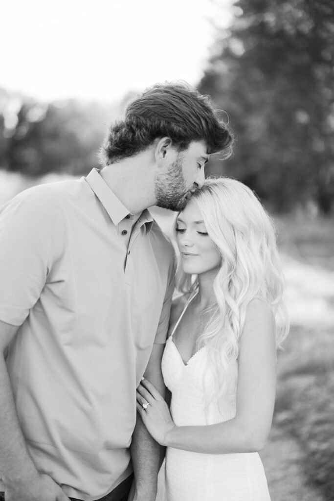 engagement session location idea, couple posing on path in nature 