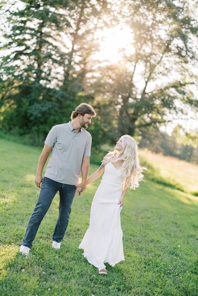 engagement session location idea, couple walking through nature