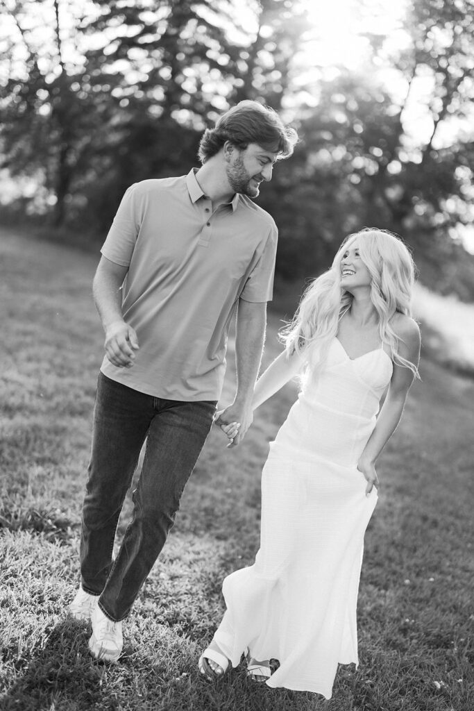 engagement session location idea, couple walking through nature