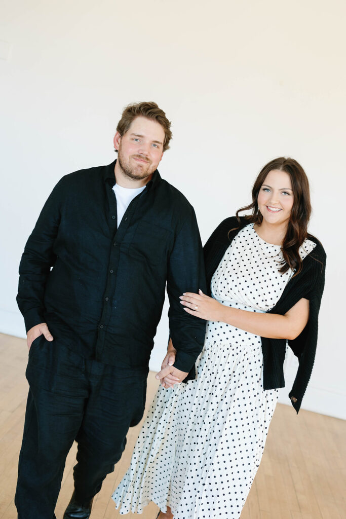 engagement session location idea, couple posing in a studio