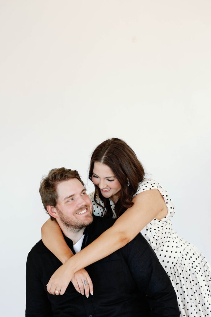 engagement session location idea, couple posing in a studio