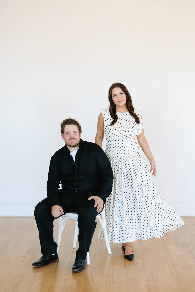 engagement session location idea, couple posing in a studio