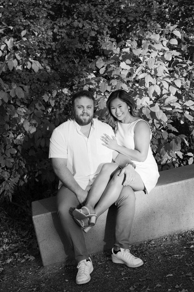 engagement session location idea, couple sitting on a bench in a park