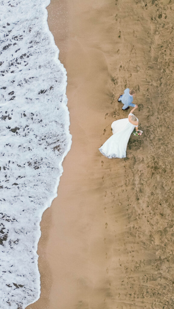 bride and groom, drone arial shot on the beach