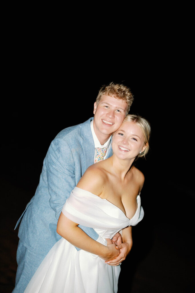 bride and groom flash portrait on the beach 