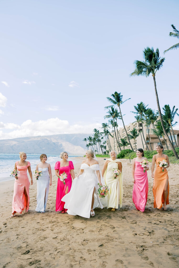 bride and bridesmaids, colorful bridesmaid dresses, wedding party on the beach