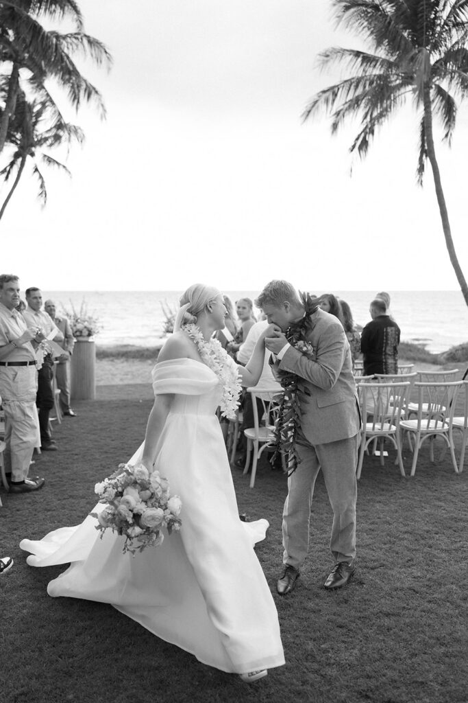 bride and groom at the ceremony alter, bride and groom kiss