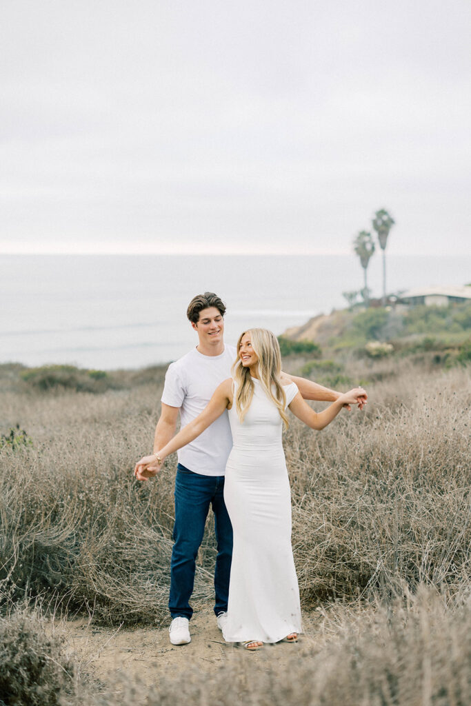 engagement session location idea, couple posing on the beach