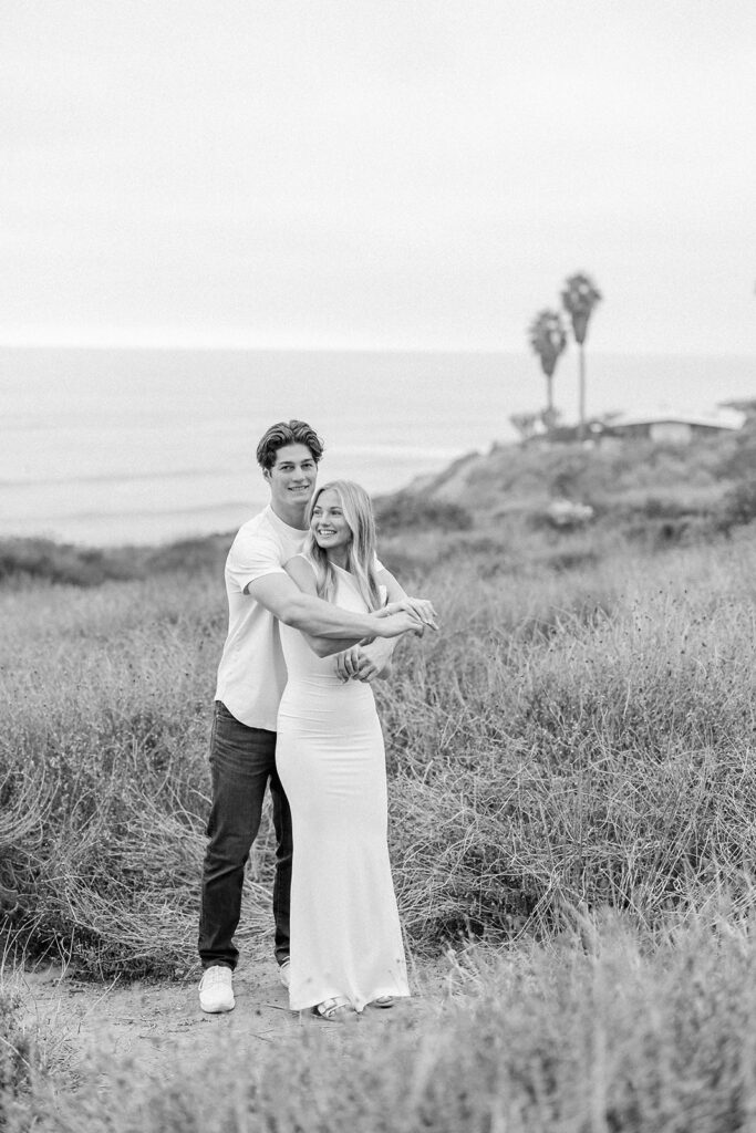 engagement session location idea, couple embracing on the beach