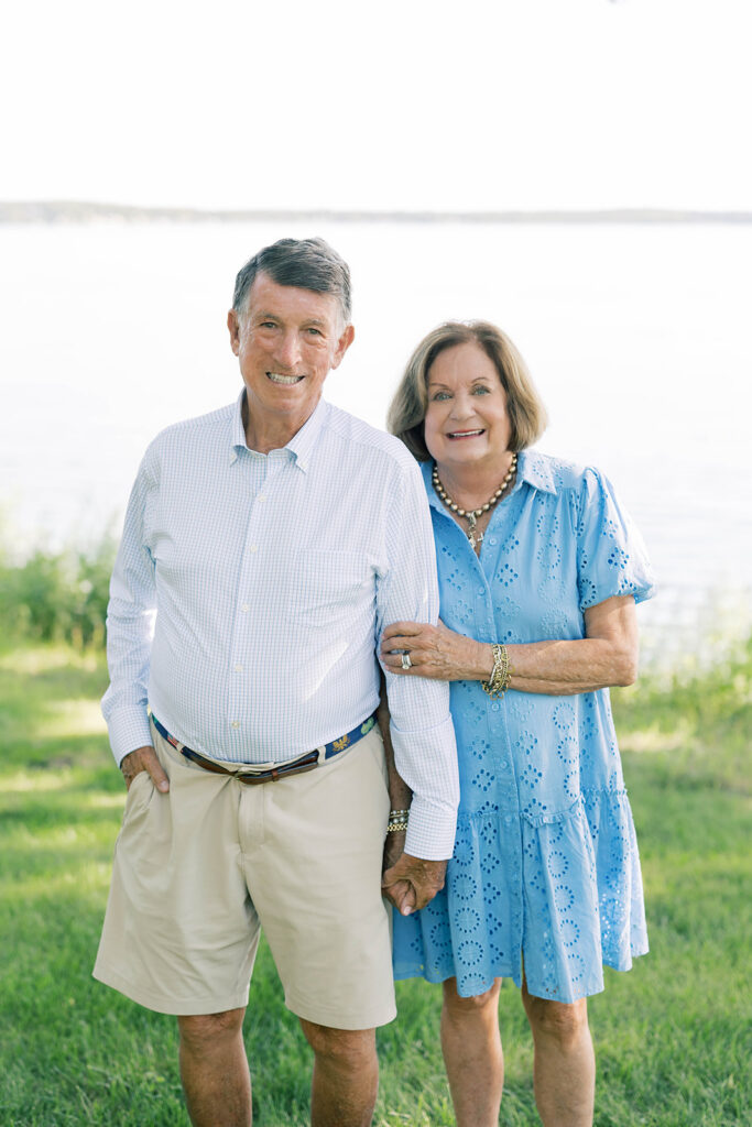 Family Portraits, older couple posing in front of a lake