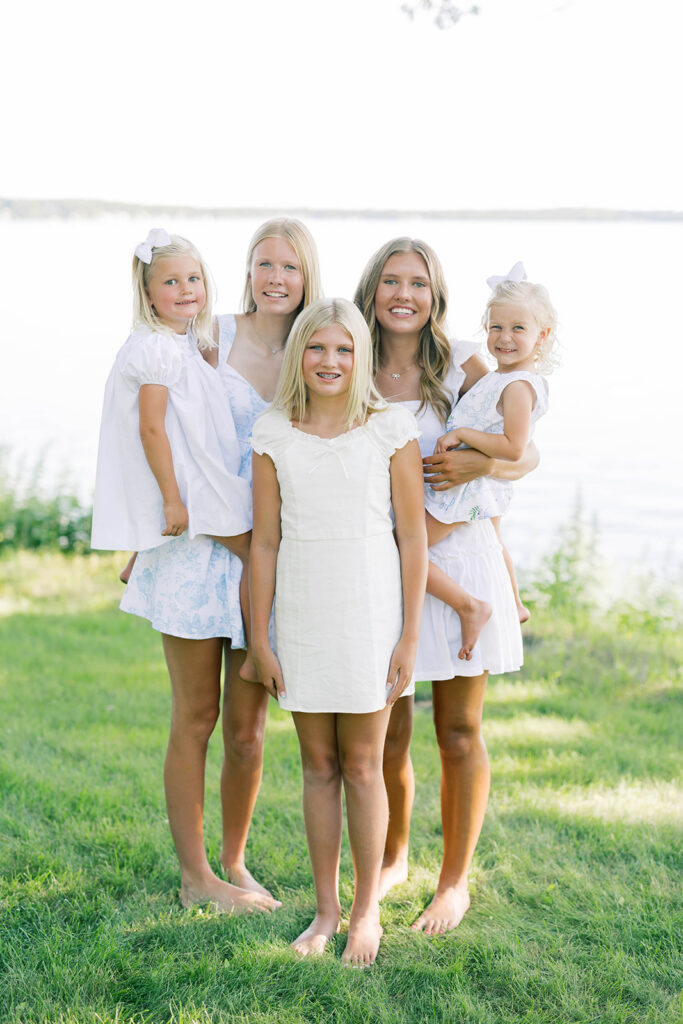 Family Portraits, siblings posing in front of a lake