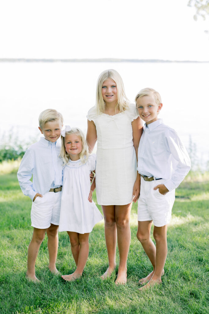 Family Portraits, siblings posing in front of a lake