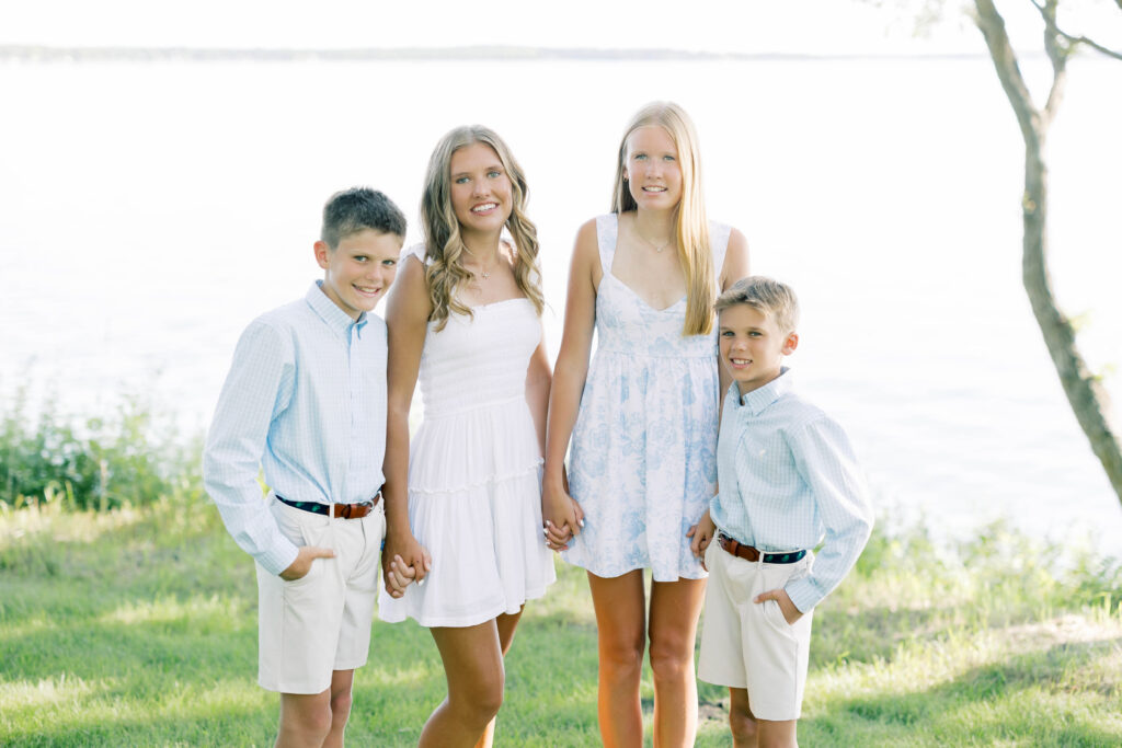 Family Portraits, siblings posing in front of a lake