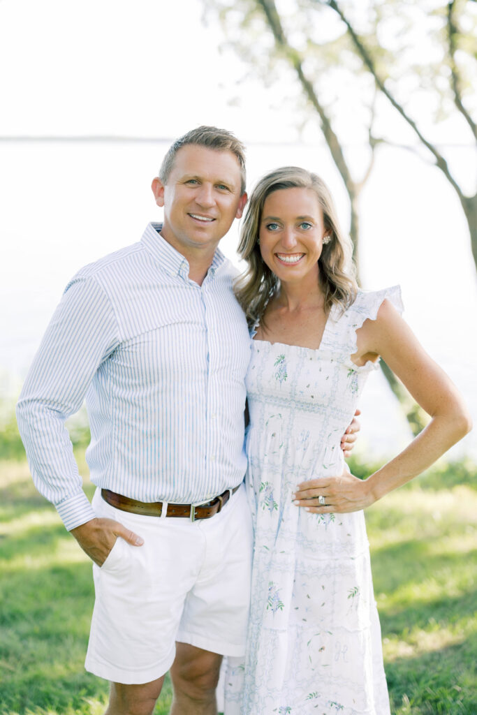 Family Portraits, couple posing in front of a lake