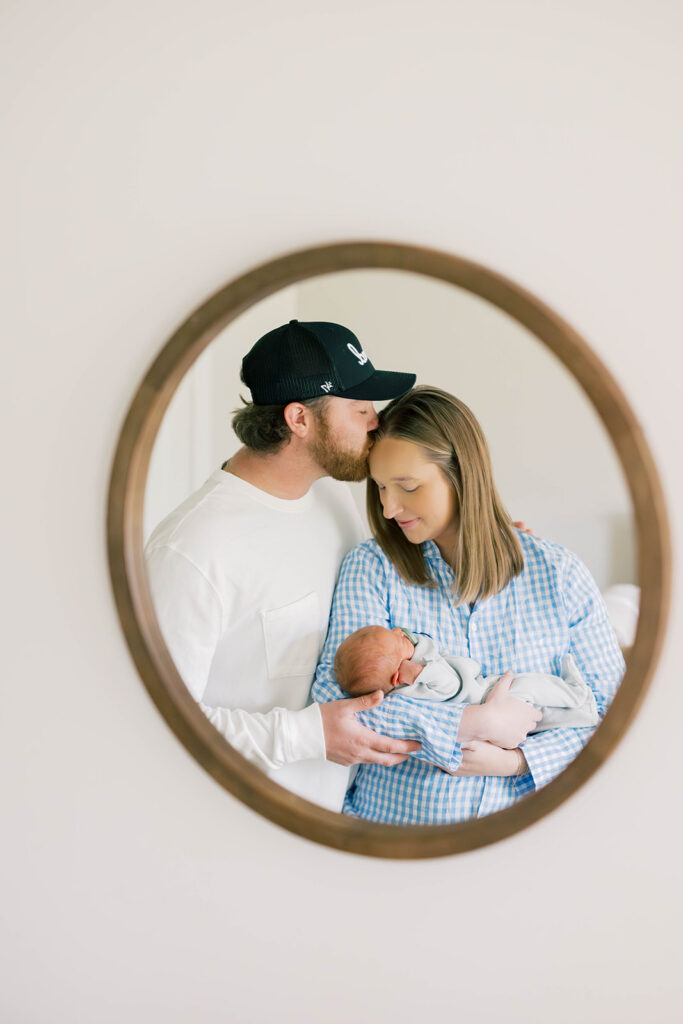 Maternity Session, couple holding newborn baby in front of a mirror