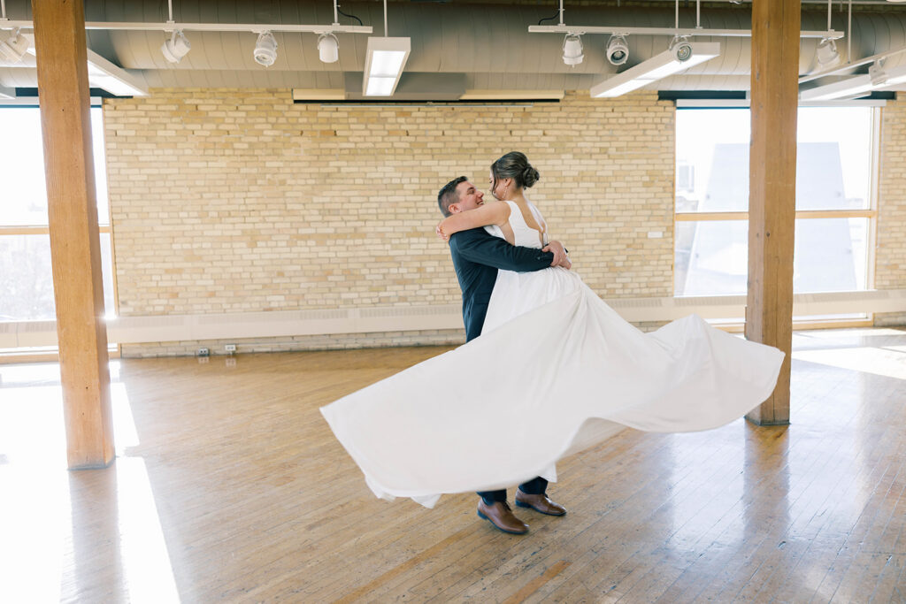 bride and groom twirelling