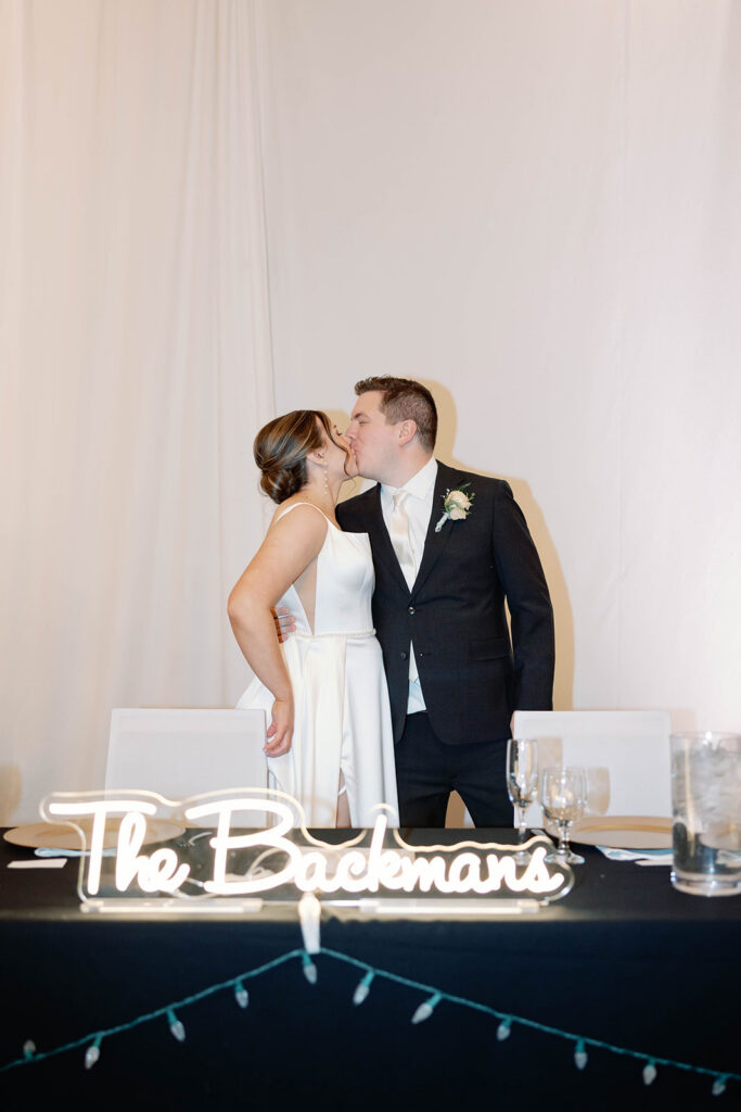 bride and groom kiss