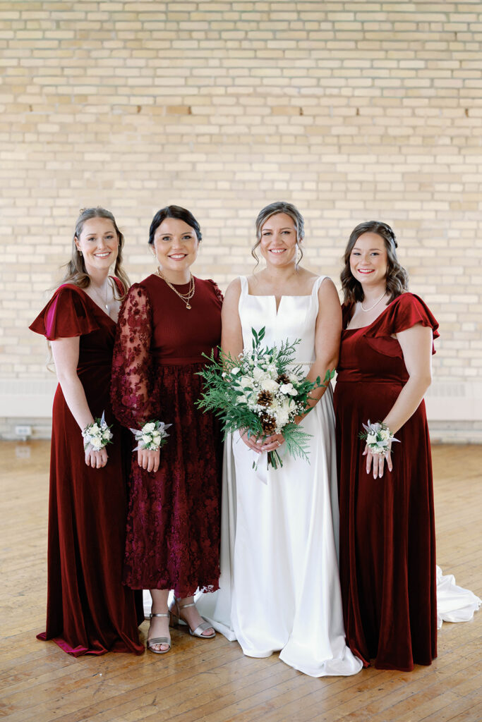 bride and bridesmaids in red dresses