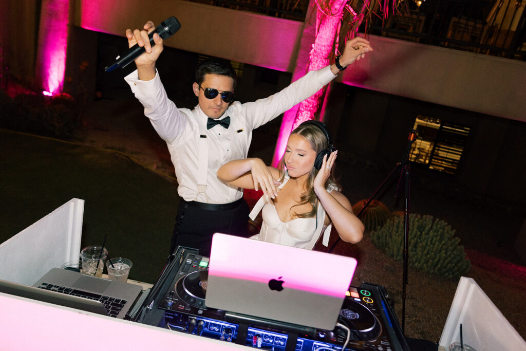 Scottsdale Wedding, bride and groom at the DJ booth