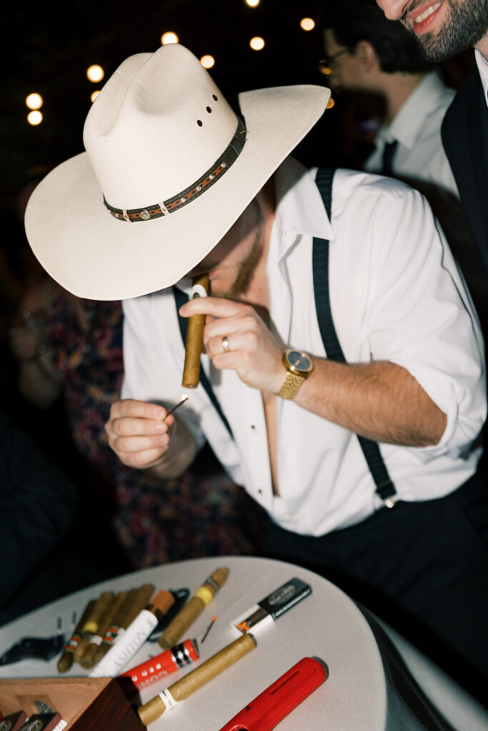 Scottsdale Wedding, guest lighting a cigar