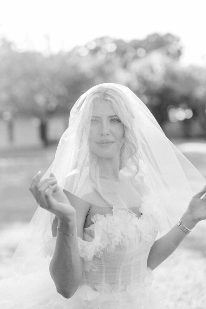 black and white portrait of a bride under a veil