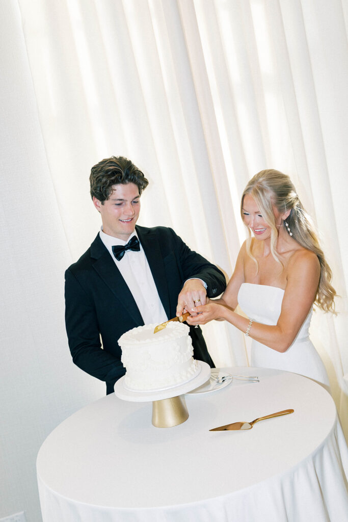 bride and groom cutting cake