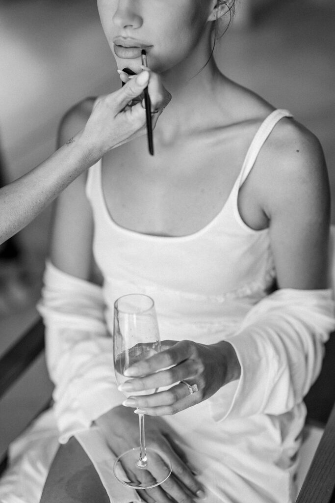 bride getting makeup done