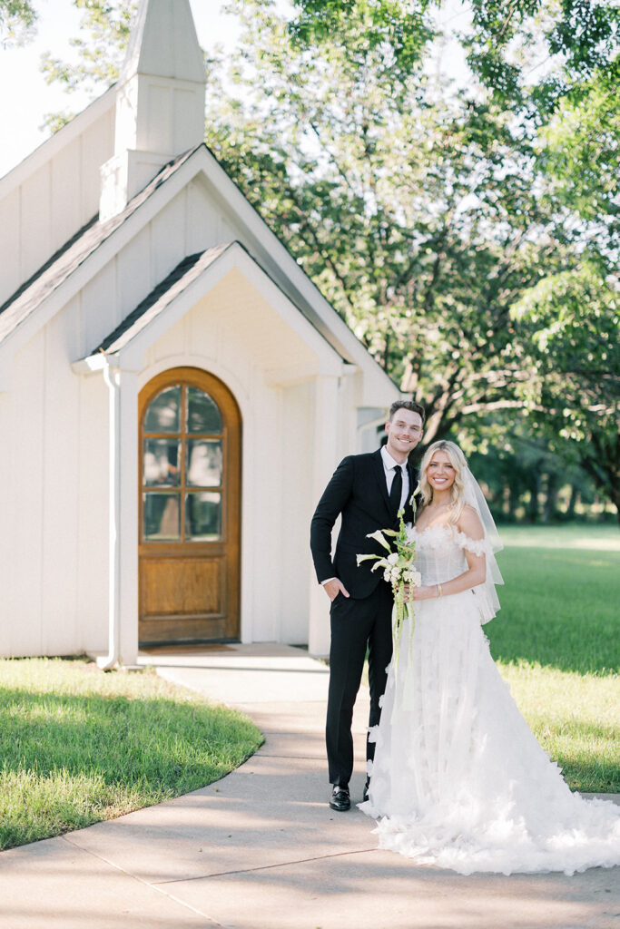 bride and groom portrait in front of the emerson wedding chapel in dfw
