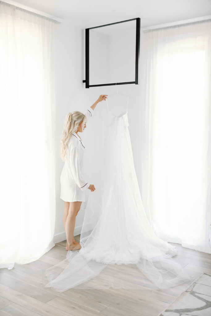 bride getting on wedding dress
