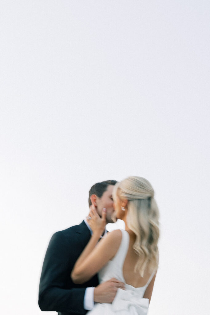 bride and groom kiss