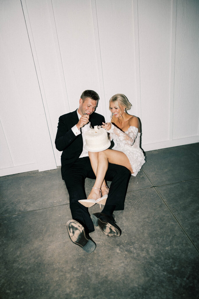 bride and groom eating cake