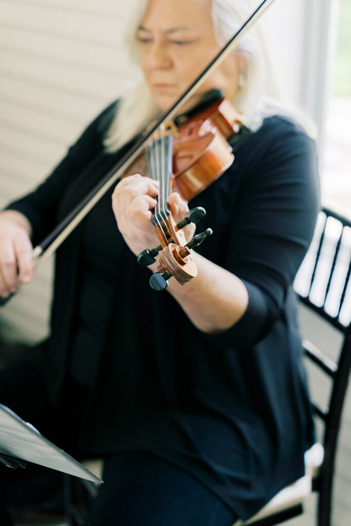 Musician playing violin at the ceremony