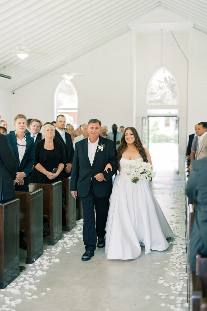 Bride and father walking into ceremony