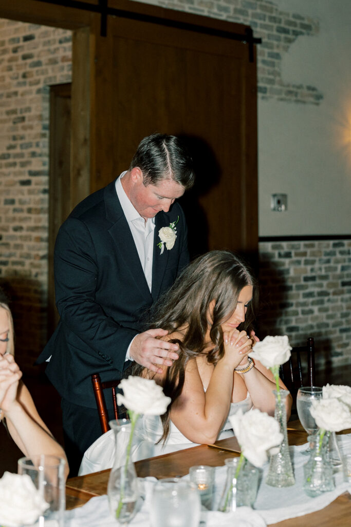 Bride and groom praying