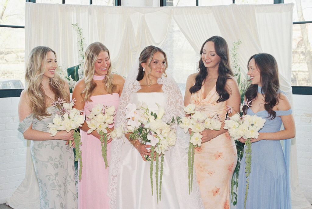 bride and bridesmaids spring colors whimsical flowers 