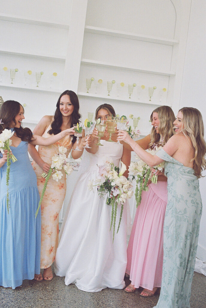 bride and bridesmaids spring colors whimsical flowers 