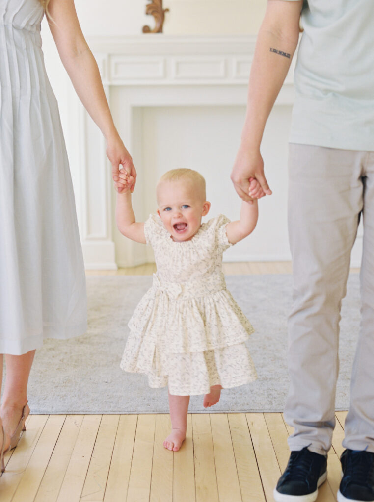 little girl with her mom and dad