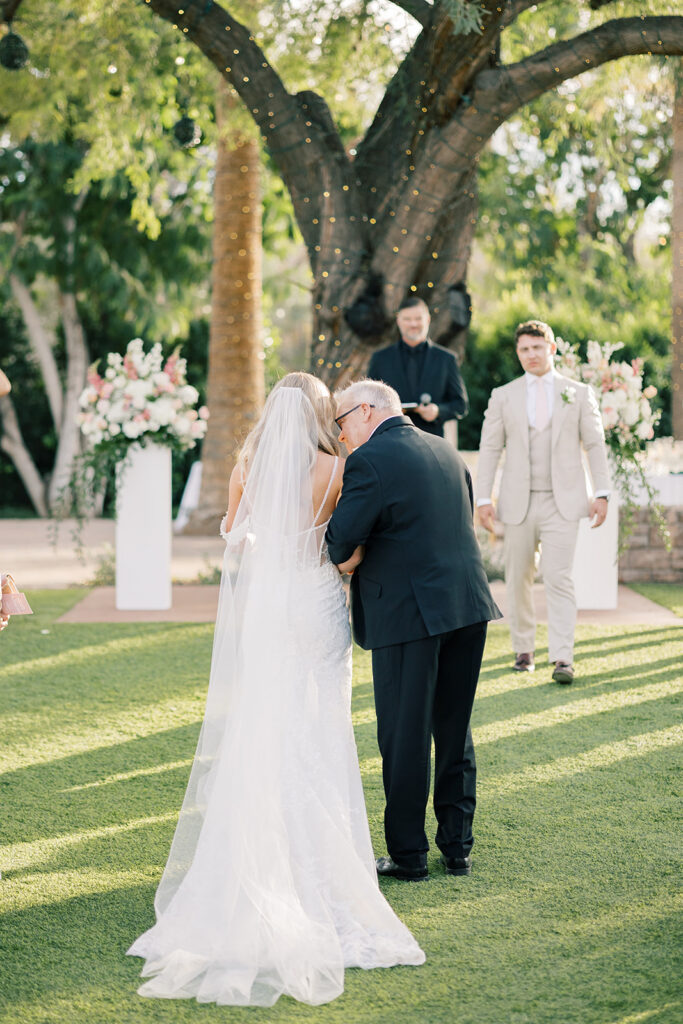 bride and dad walking down the isle 