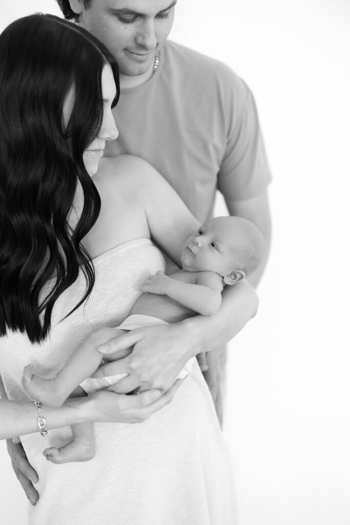 black and white newborn and parents portrait