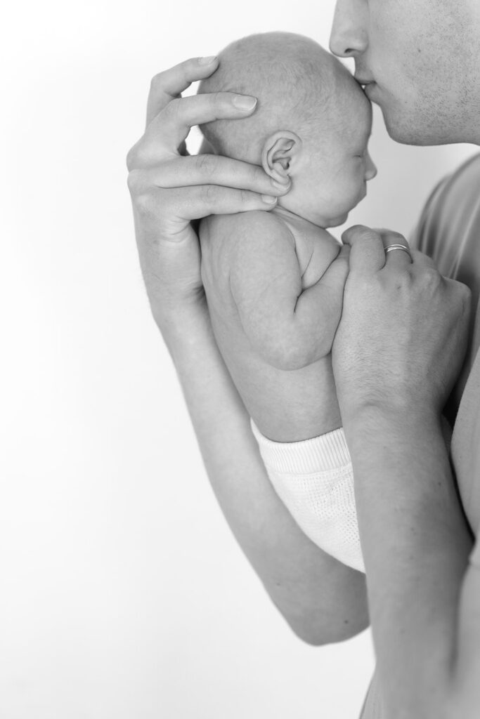 black and white newborn and dad portrait