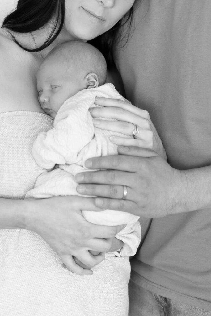 black and white newborn and parents portrait